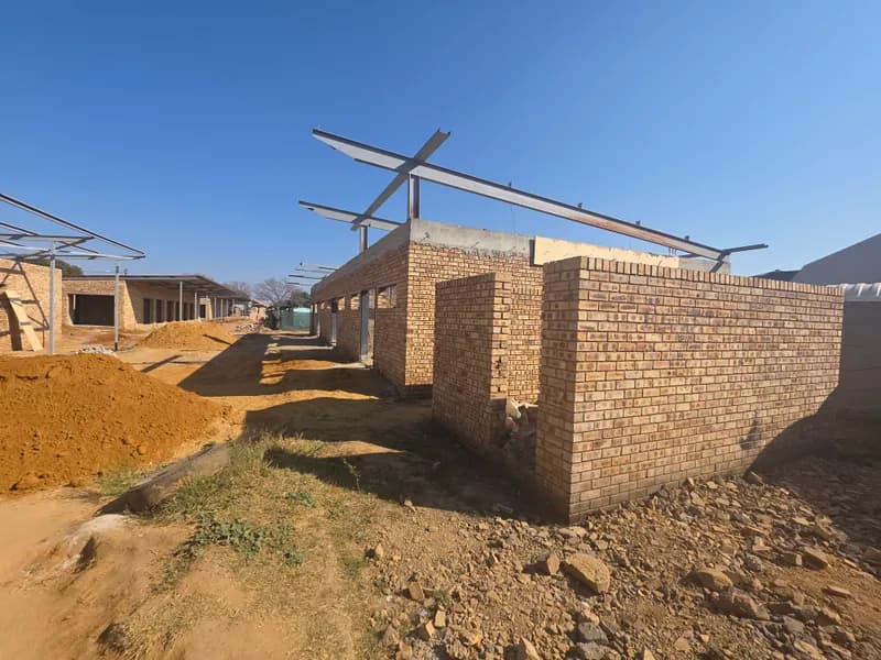 Steel roof framing over new brickwork
