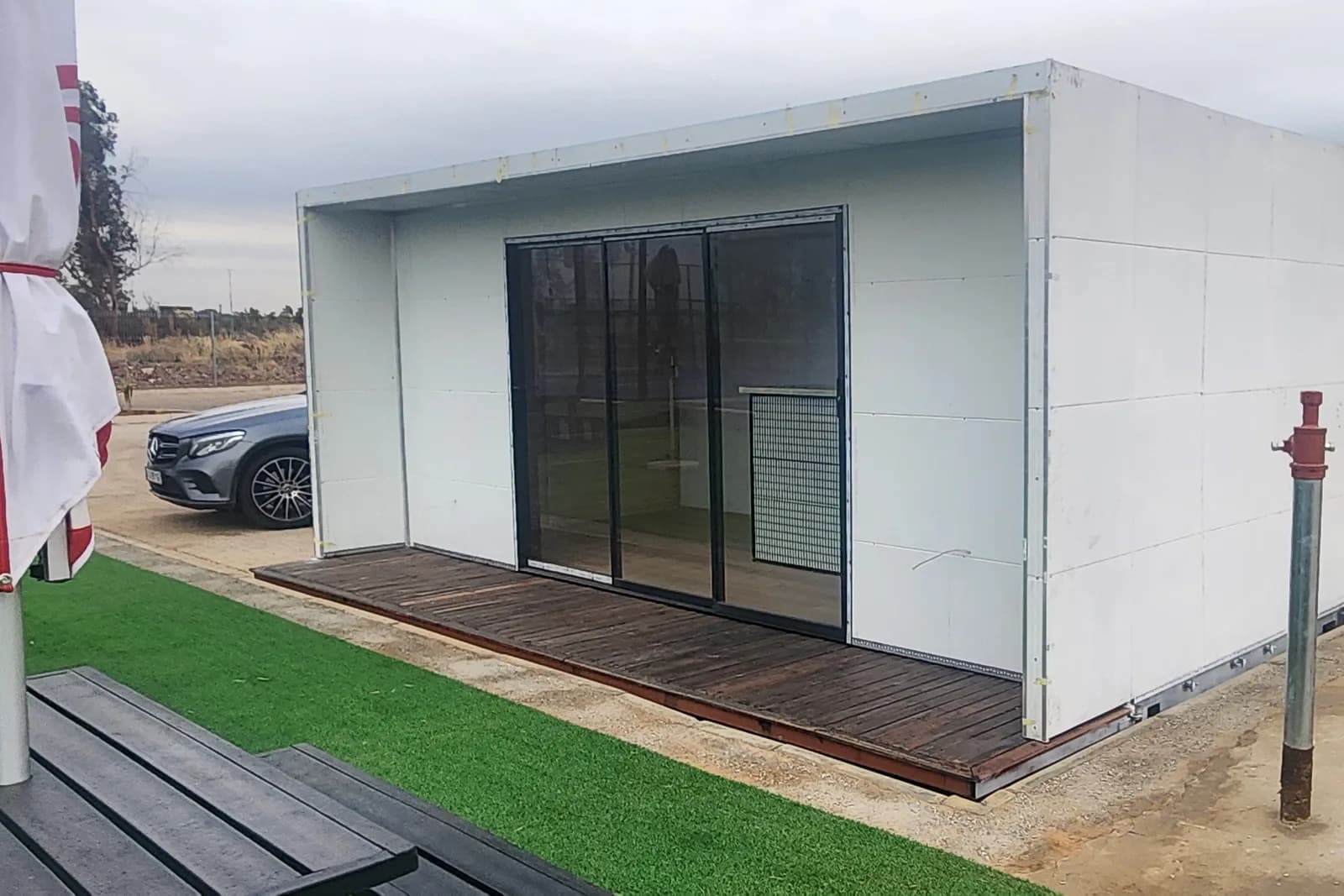 A converted container fitted with glass doors
